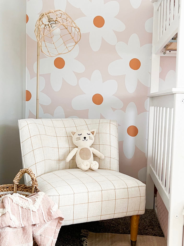 Reading corner in girls room with daisy floral wallpaper