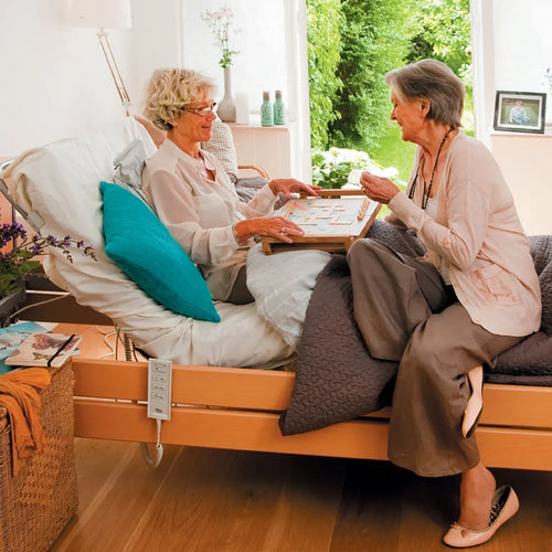 Invacare Medly Ergo Profiling bed in use