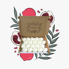 A box Pomegranate Noir Wax Melts with illustrated Pomegrantes and foliage
