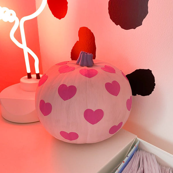 Sprinkle Club - A hand painted pink pumpkin with love heart stickers and a painted purple stalk