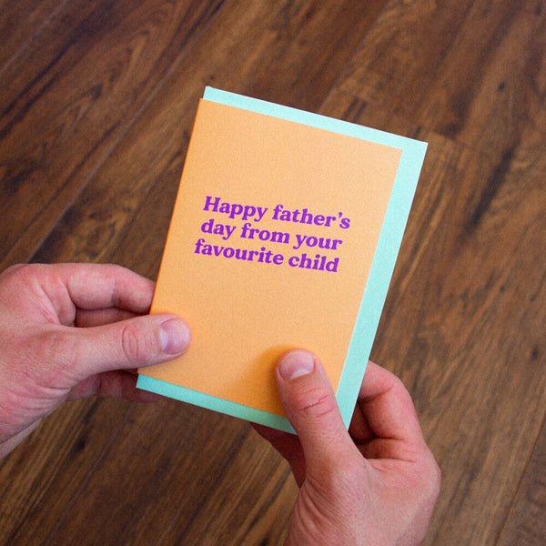 Sprinkle Club - A funny orange Father's Day card with a green envelope that says 'Happy Father's Day from your favourite child' on the front