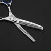 thinning shears with taichi industries logo on it