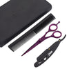 Purple scissors, black razor, comb, and pouch on white background arrangement