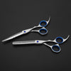 styling scissors and thinner on black background color