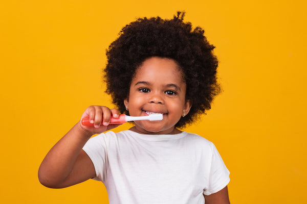 Child brushes teeth