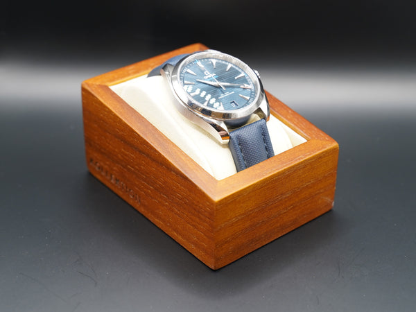 A wooden watch case with a microsuede interior is the perfect way to show off your collection of watches. This stylish case is available in both beige and grey.