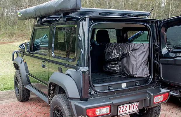 4m Convertible Elite inflatable kayak in the back of a small car