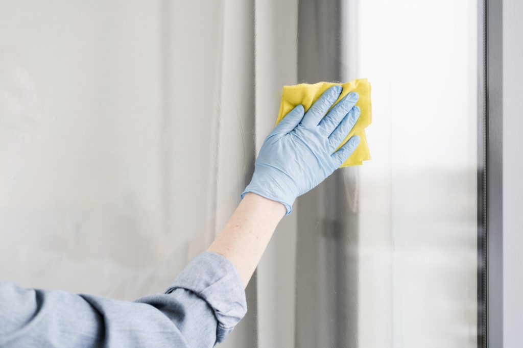 Avoiding moisture buildup by wiping down the walls