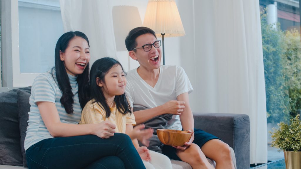 Asian family enjoy their free time relax together at home