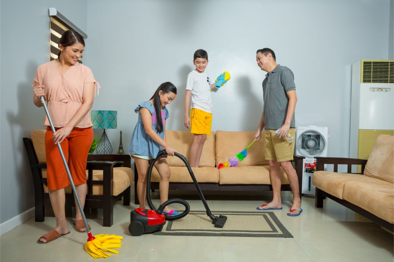 A family cleaning the home