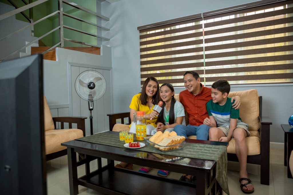 Family having fun with karaoke