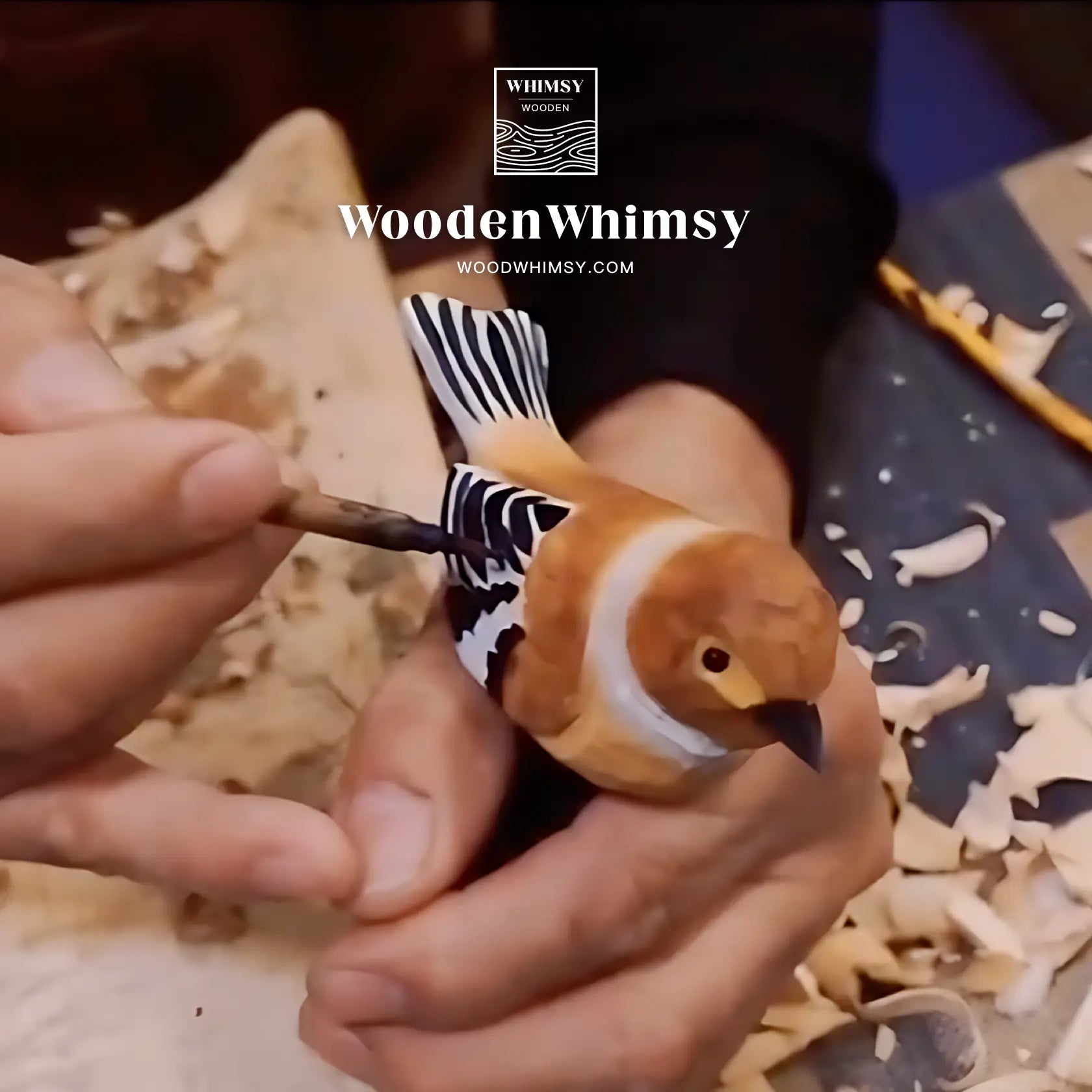 Craftsmen coloring wood carvings of birds
