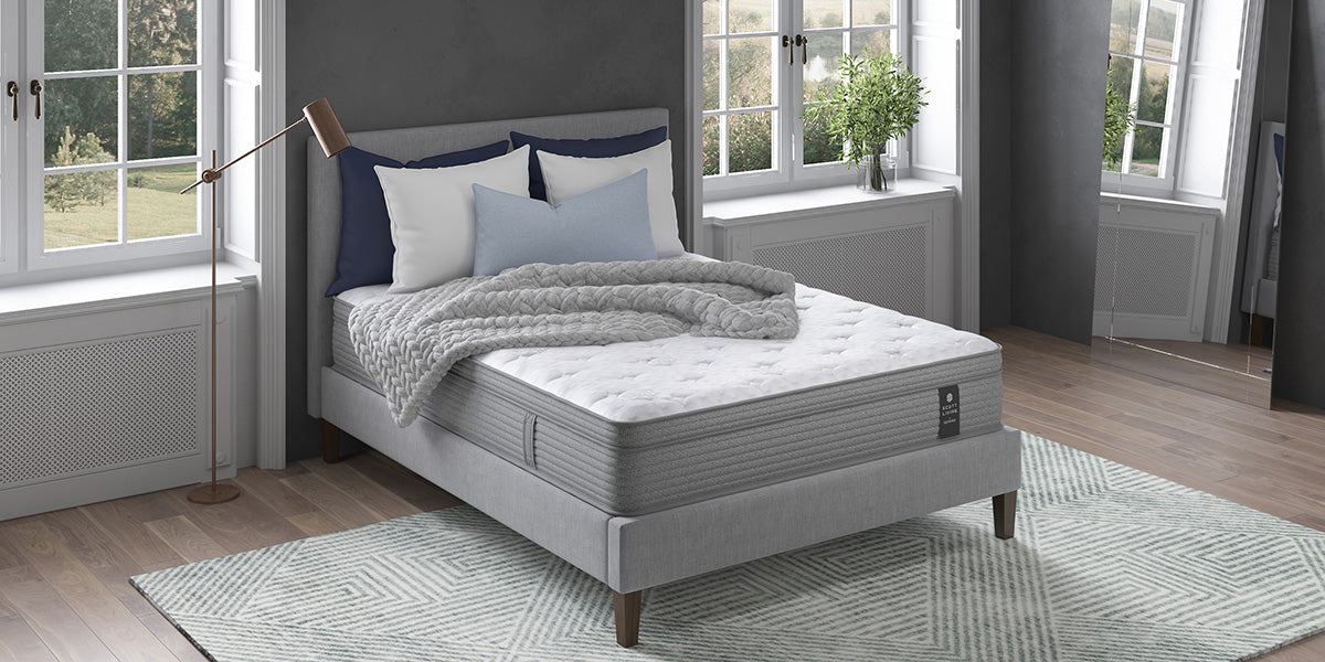 Scott Living mattress in a gray bedroom with large windows on either side of the bed
