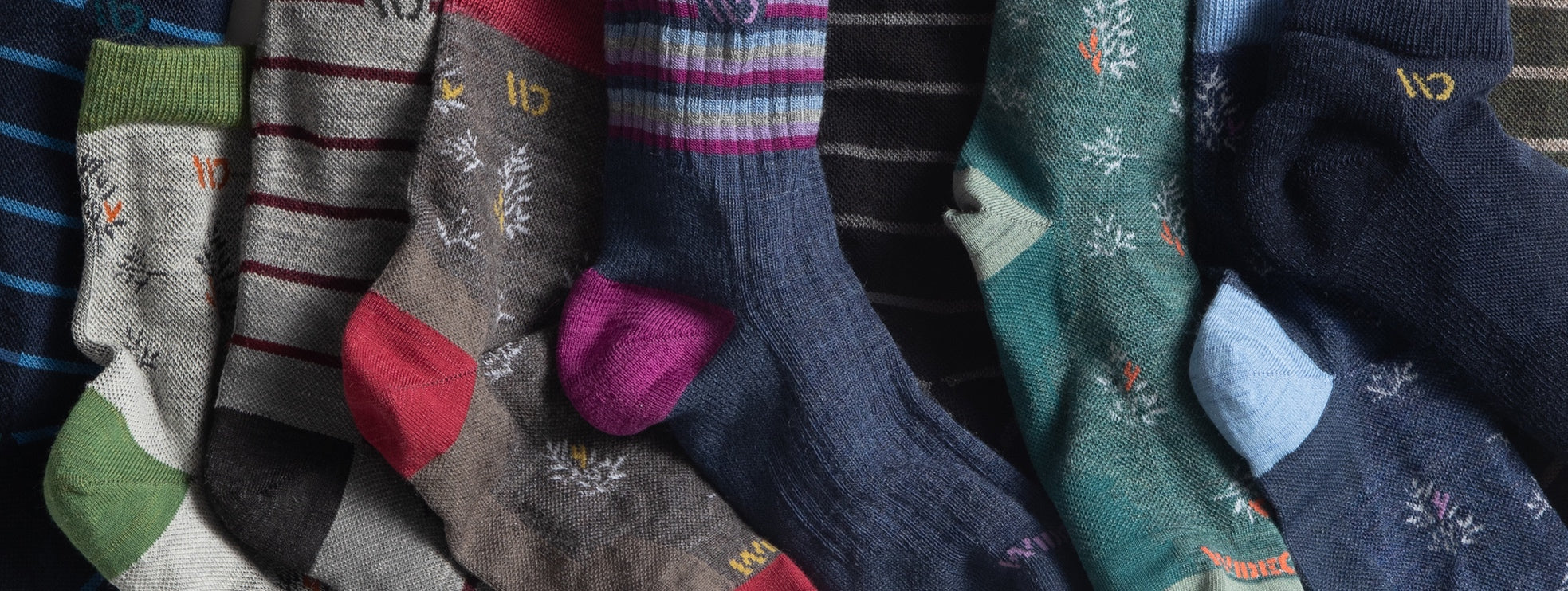 A line up of Wide Open socks showing the different colors and patterns