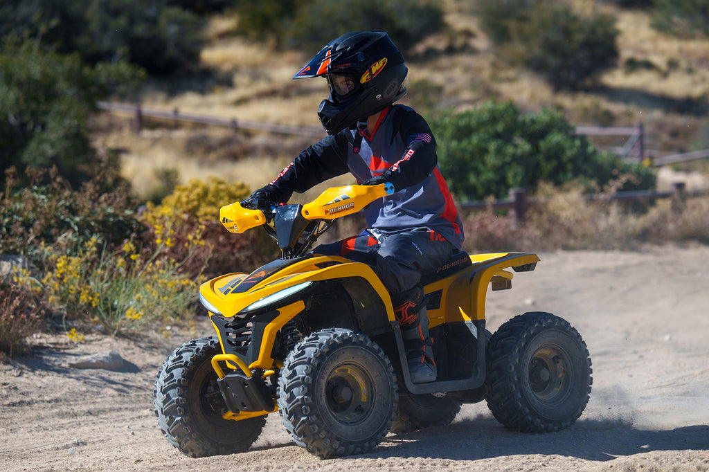 Child riding a Denago Powersports E Hawk 6 on an off road trail.