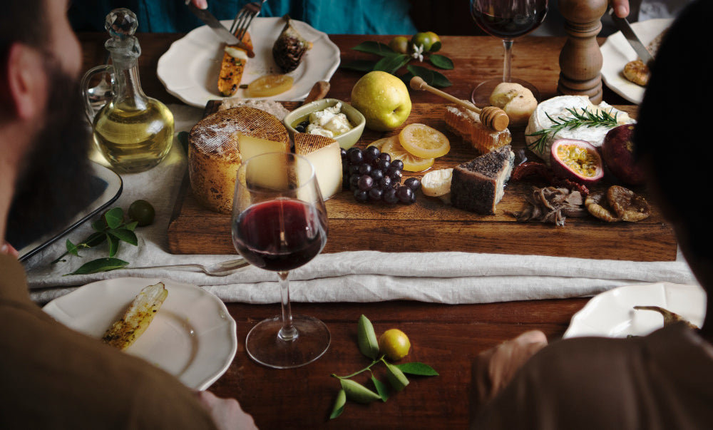 non-alcoholic red wine and a beautiful table of food