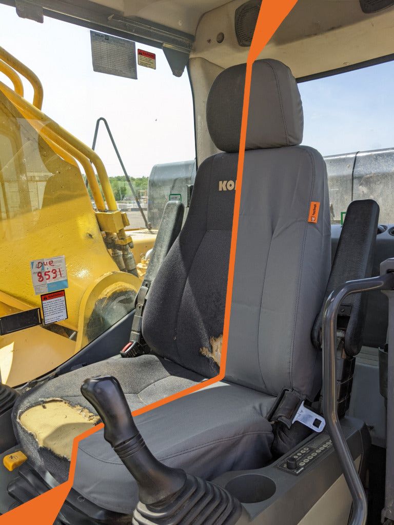 heavy equipment with a seat cover on and then off.