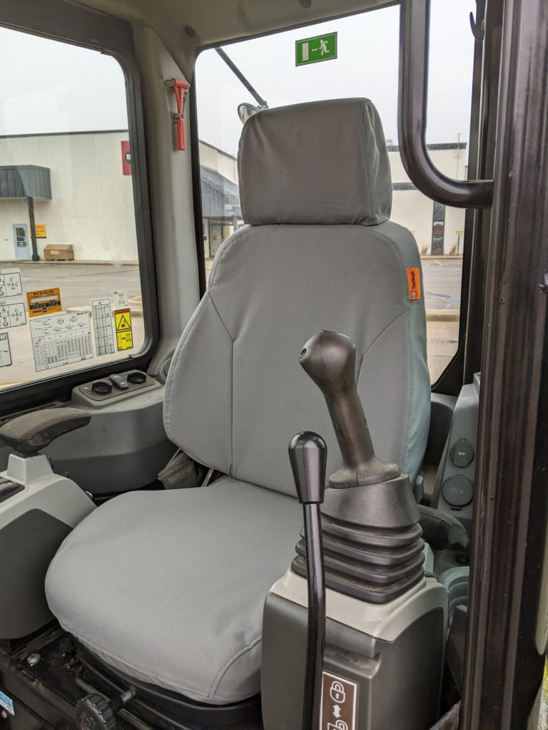 TigerTough seat cover on a CAT mini excavator seat