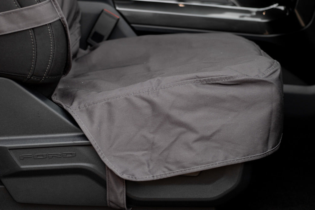 WeatherTech Seat Protector covering the seat controls on a Ford F-150