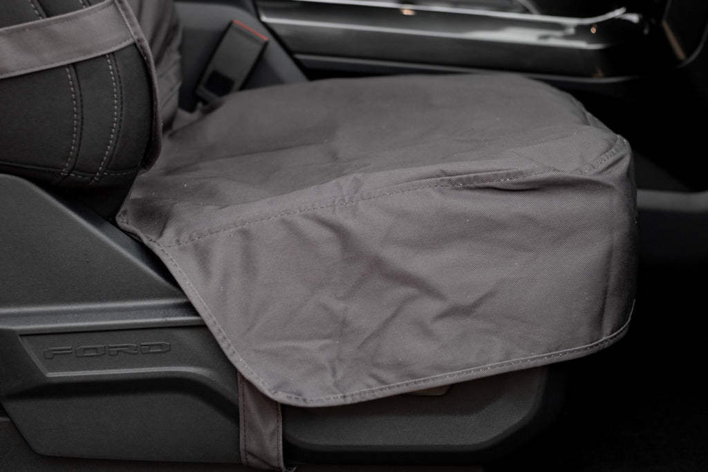 WeatherTech seat cover skirt covering the control panel on the passenger's seat on a Ford F150