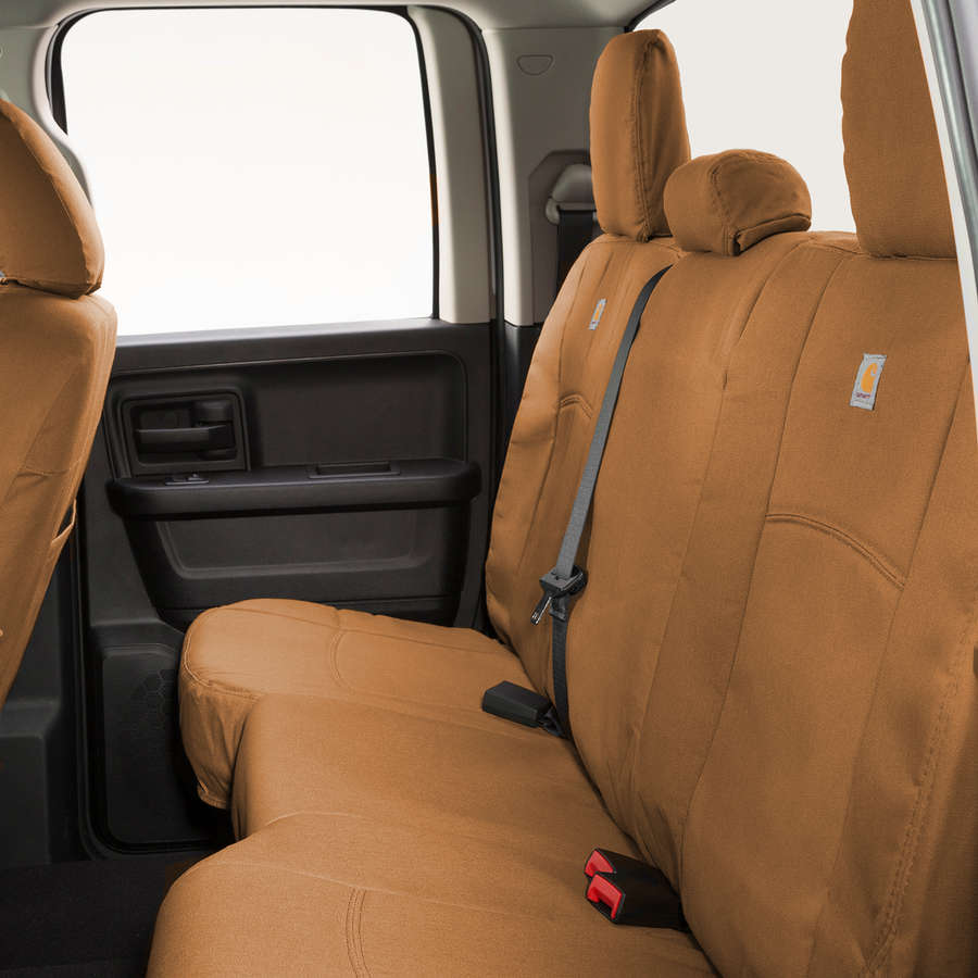 Tan Carhartt PrecisionFit seat covers on the bench seat of a Ford F150.