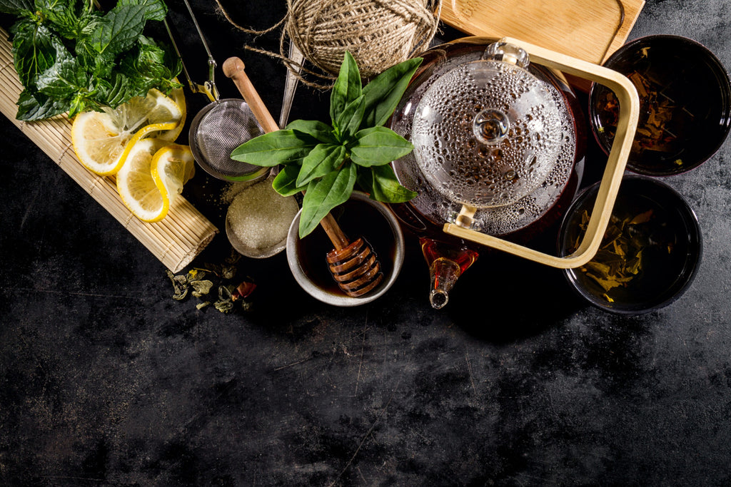 tasty-fresh-green-tea-glass-teapot-ceremony-dark-background