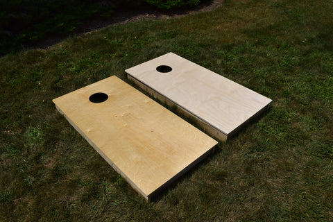 Cornhole board comparison of an unfinished board versus a board finished with oil-based polyurethane