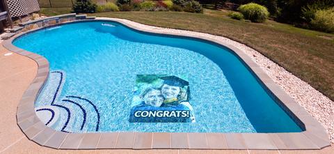 Graduation-themed pool mat in a pool