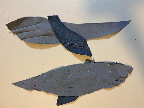 place the fins on denim whale