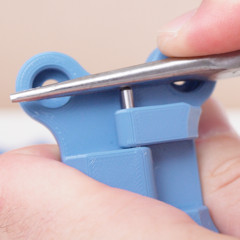 needle nose pliers pressing dowel rod into hinge for 3d printer enclosure