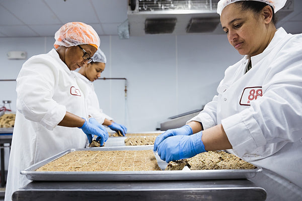 88 Acres Team members baking Seed Bars and blending Seed Butters