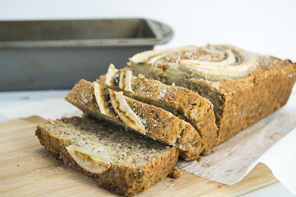 Sliced loaf of fresh banana bread. Grab a slice and take it for the road!