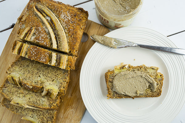 Slice of banana bread with seed butter. Send a slice with the kids for lunch!
