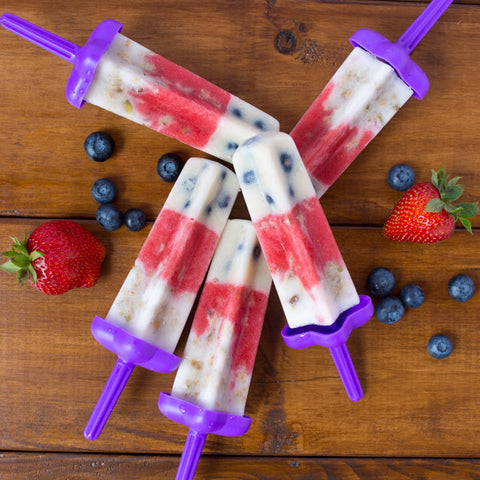 Layered berry popsicles with fresh blueberries and strawberries. Great on-the-go snack or dessert. 