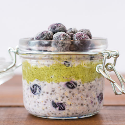 Overnight oats with raisins, chia seeds, pumpkin seed butter, topped with blueberries. Quick, healthy breakfast. 