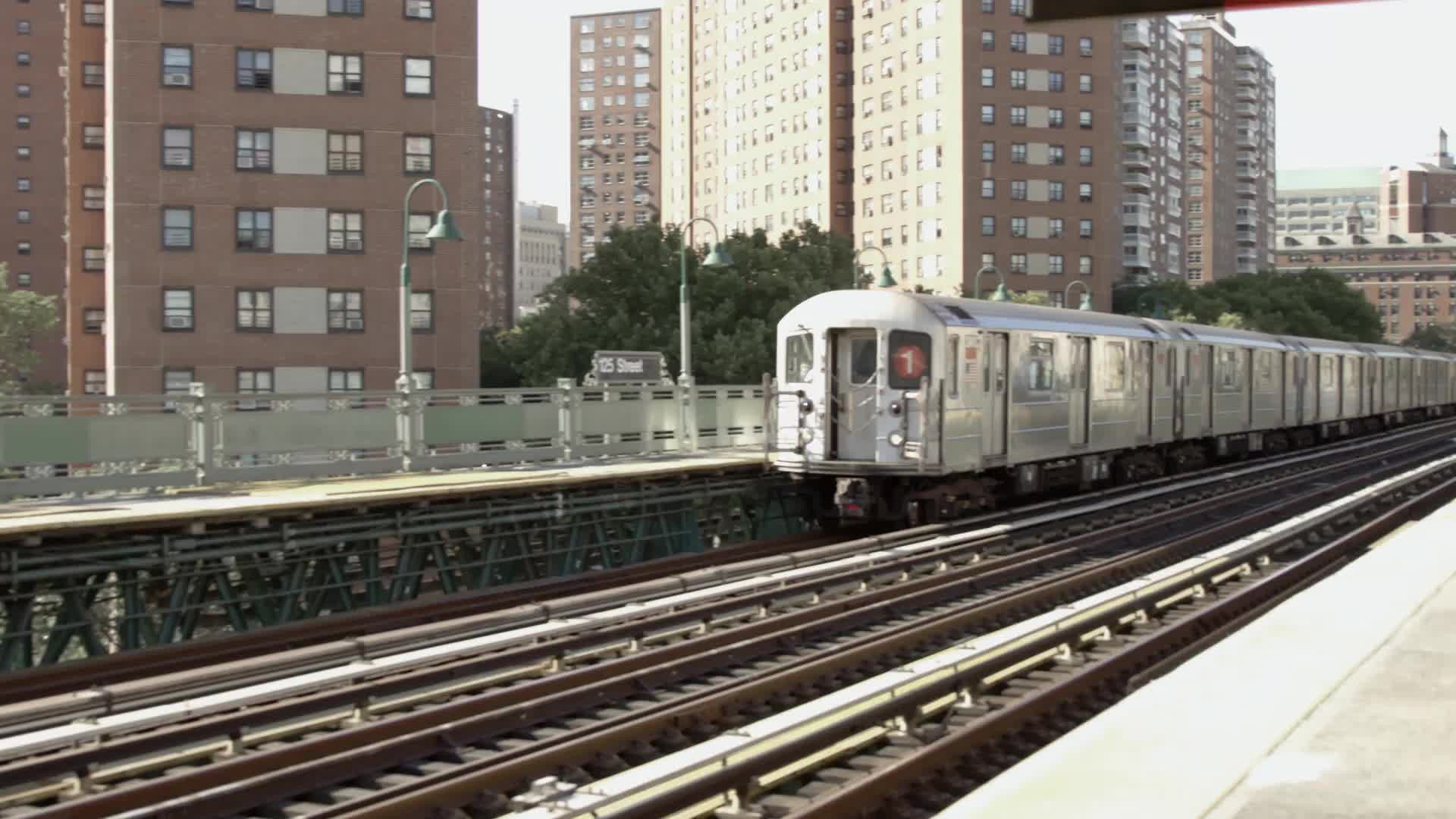 1 Train entering elevated 125th street station in Harlem NYC - NY Clips