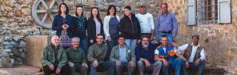 The team at Castello di Romitorio posing for a photo outside the estate