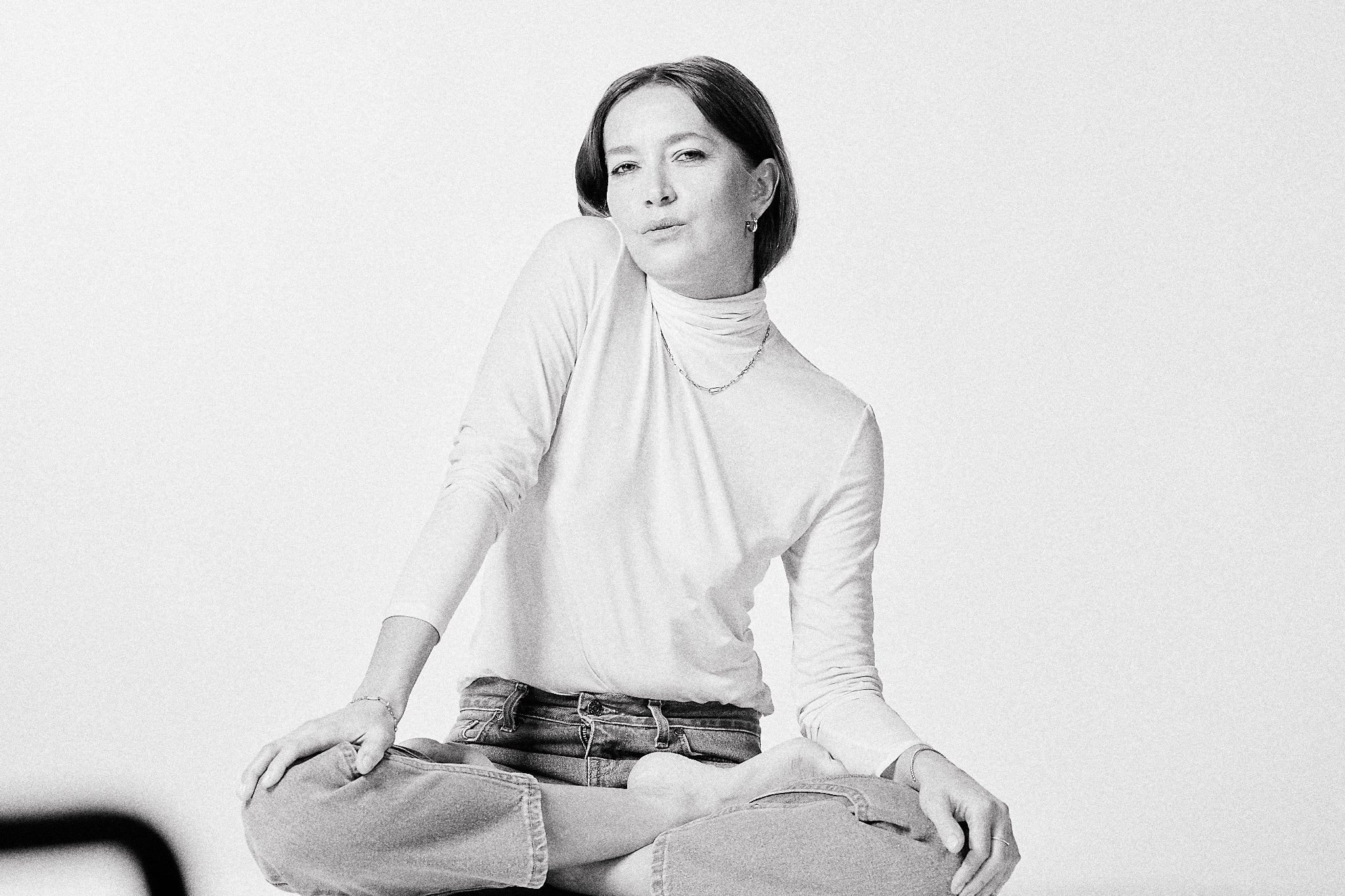 woman sitting calmly in jewelry