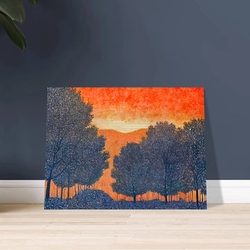 Silhouettes of trees in deep blue frame a vivid orange sky, evoking a fiery sunset over quiet hills dotted with tiny white specks.
