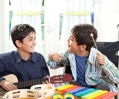 Disabled Children playing Musical Toys