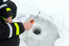 Ice Fisherman Jigging for trout 