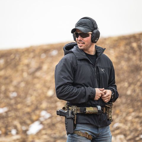 man in warm clothing with duty belt and sidearm