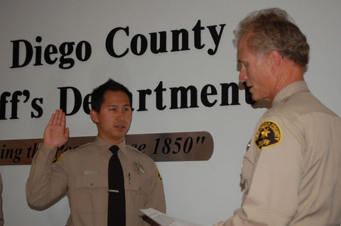 Qore Performance Co-Founder Justin Li being sworn in with the San Diego Sheriff's Department