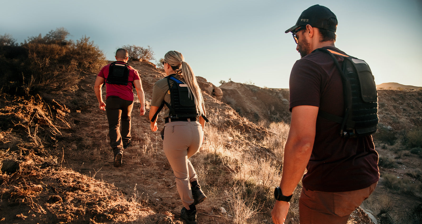 Hikers in the US desert with IMS Sport cooling, heating hydration bladders.