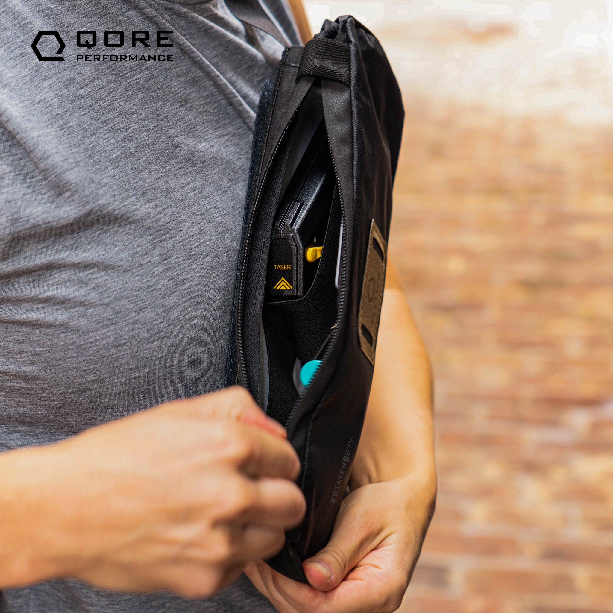 EDC Travel Sling by Qore Performance for walking, hiking, travel, every day carry, bike riding can carry a Taser Pulse, Glock 43, Sig Sauer P365, or Pepper Spray