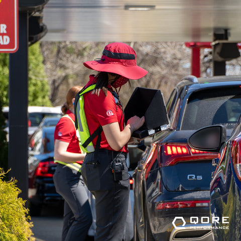 Chick-fil-A drive thru team members use IcePlate HiVis Backpack and IceCase iPad Cooling to maximize drive thru productivity