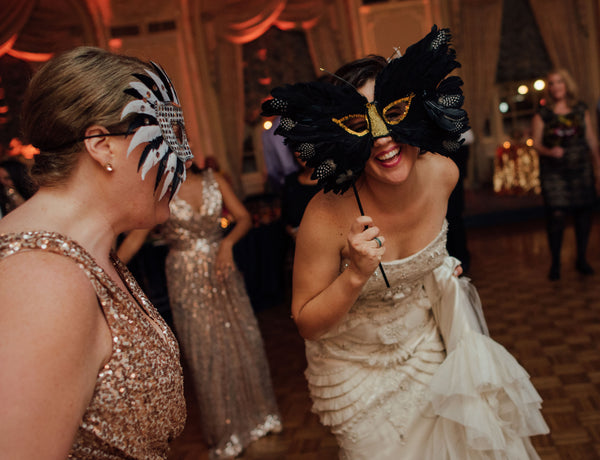 feather masks at art deco wedding reception
