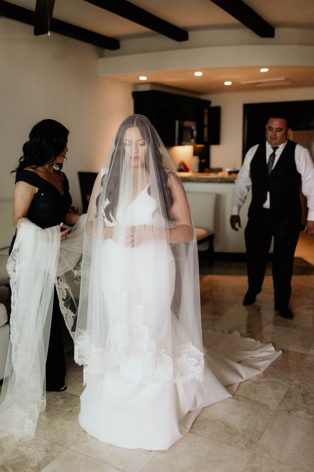 getting ready for wedding in mantilla veil