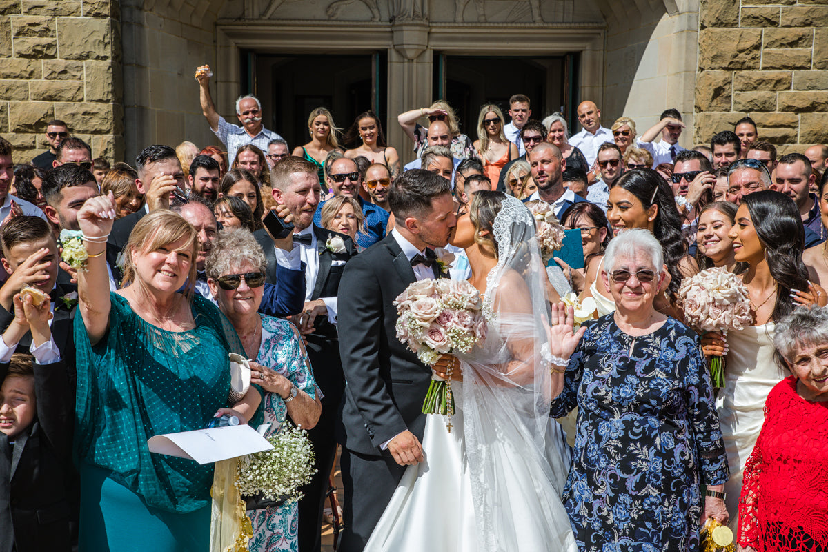 bride and groom leaving cathedral wedding