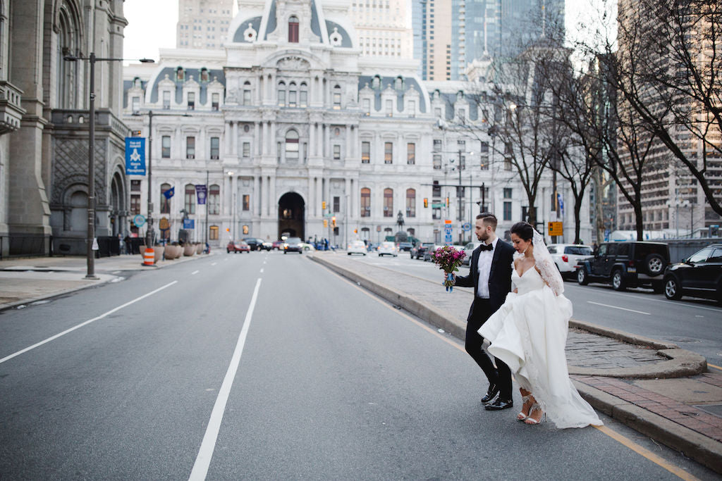 bride and groom crossing the street downtown philadelphia wedding